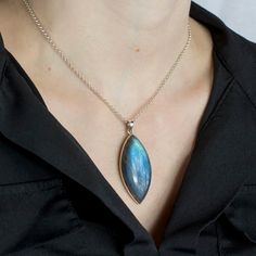 This marquis cabochon Labradorite pendant set in handcrafted 925 sterling silver commands attention with an electric blue & occasionally multi-colored shine. This Labradorite necklace, also known as the stone of energy, allows you to be yourself. Labradorite is a stone of vigor and inventiveness that may infuse your life with a lot of energy. Stone Origin: Madagascar Measures Approximately: 41 x 21 mm Materials: Hand Crafted 925 Polished Sterling Silver and Italian adjustable Belcher chain. Plea Labradorite Necklace, Labradorite Necklaces, Cabochon Pendant, Mala Necklace, Labradorite Pendant, The Stone, Turquoise Pendant, Rock Style, Pendant Set