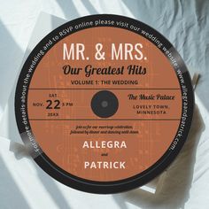 an orange label with the words mr & mrs our greatest hits written on it in black