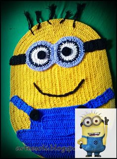 a crocheted yellow and blue minion hat