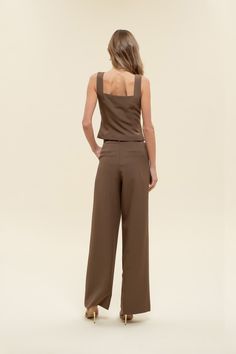 Office chic to date night to weekends looking cutie while on-the go, dress to impress in our Greenwich pleat trousers. These high-waisted pants feature a hook and eye closure, belt loops, back pockets, slick side pockets, pleated detailing, a wide leg with a flared hemline, and let's not forget they are the color of the season - chocolate BROWN! Designed in the USA. Imported Fabric Content: 88% Polyester, 12% Spandex. Inner Lining: 100% Polyester Model is 5'6 and is wearing a size Small. Chic Solid Pants With Pleated Waist, Chic Belted Straight Leg Dress Pants, Elegant Belted Solid Wide Leg Pants, Chic Belted Ankle-length Pants, Chic Pleated Waist Pants For Fall, Elegant Solid Color Belted Wide Leg Pants, Chic Pleated Waist Bottoms For Workwear, Chic Formal Dress Pants With Elastic Waistband, Belted High Waist Bottoms For Date Night