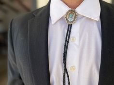 This awesome bolo tie has a southwestern design and agate centerpiece. The cord is genuine leather. Our bolos pair nicely with many of our belt buckles! They make wonderful gifts. The western bolo tie rope length is 39'' ; charm agate stone pendant size is 2'' x 1 1/2'' Adjustable Southwestern Bolo Tie For Formal Occasions, Southwestern Style Adjustable Bolo Tie For Formal Occasions, Southwestern Style Formal Bolo Tie, Elegant Concho Bolo Tie, Adjustable Western Bolo Tie For Formal Occasions, Adjustable Formal Bolo Tie With Concho, Formal Concho Bolo Ties, Formal Adjustable Concho Bolo Ties, Elegant Adjustable Concho Bolo Ties