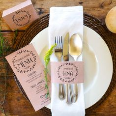 a place setting with silverware and napkins