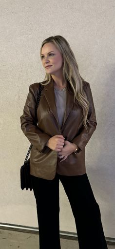 Out luxurious Cambridge Faux Leather Blazer is a must-have for any wardrobe. Crafted from brown faux leather, this blazer is both stylish and comfortable. It's the perfect addition to any outfit, whether you're heading to the office or on a night out. Runs slightly small. Model is wearing a Medium. Sleek Brown Leather Jacket For Fall, Sleek Brown Leather Outerwear, Fall Leather Jacket For Workwear, Brown Faux Leather Blazer For Office, Elegant Brown Leather Jacket For Fall, Winter Business Faux Leather Blazer, Winter Formal Faux Leather Blazer, Brown Faux Leather Office Blazer, Brown Fall Blazer For Night Out