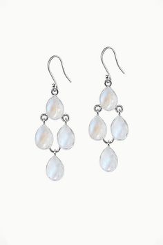 Connect with your inner natural beauty with our authentic Moonstone Earrings - Dew Drops. Sleek, stylish and feather-light, these pretty dangle earrings reflect the effortless beauty that comes from within. A statement such as our Dew Drops will take you from airy summer picnics to cozy winter get-togethers in style. A striking addition on their own or matched with your Dew Drops Necklace, these enchanting earrings are sure to become a favorite. Authentic Sivalya Moonstone Moonstone: Goddess Ene Elegant Moonstone Drop Earrings, Elegant White Moon Phase Earrings, White Moon Phase Dangle Jewelry, Drop Moonstone Earrings With Natural Stones, White Moonstone Earrings With Natural Stones, White Teardrop Sterling Silver Chandelier Earrings, Elegant White Moonstone Crystal Earrings, White Moonstone Dangle Crystal Earrings, White Moonstone Long Drop Earrings