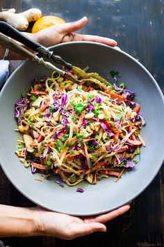 a white bowl filled with coleslaw and carrots