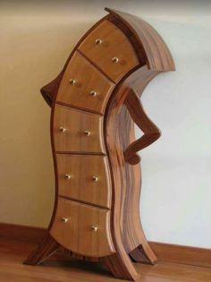 a wooden cabinet with many drawers on it's sides and an upside down shelf in the middle