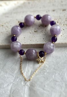 Beautiful elastic bracelet using 15mm and 8mm amethyst beads in different colors. The color and size contrast brought the bracelet a dreamy feel. Absolutely gorgeous. Get it here: https://www.etsy.com/berylcraft/listing/1323582342/chunky-amethyst-bracelet-beaded-amethyst?utm_source=Copy&utm_medium=ListingManager&utm_campaign=Share&utm_term=so.lmsm&share_time=1667340216101 Amethyst Beaded Bracelets With Round Beads, Handmade Amethyst Stretch Bracelet In Purple, Purple Beaded Bracelets With Stones As A Gift, Purple Beaded Bracelets With Stones For Gifts, Purple Gemstone Stretch Bracelet With Round Beads, Amethyst Gemstone Beaded Bracelet, Spiritual Purple Crystal Bangle Bracelet, Spiritual Purple Beaded Bracelets With Stones, Amethyst Gemstone Beads Bracelet