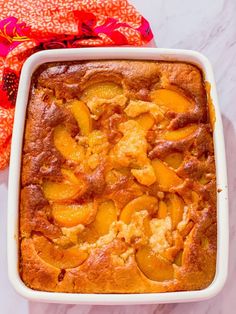 a casserole dish with peaches in it