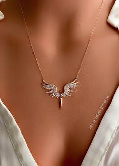 One of the most favorite wings necklaces of our customers, what are you waiting for, wear it too. Silver: 925 sterling silver and gold plated Stone: Cubic zirconia Pendant diameter: 1.57 inches-1.57 inches (4 cm- 3.5 cm) Adjustable length: 2.16 inches (5.5 cm) All the metal components are solid .925 STERLING SILVER (not plated). If you want to see the different color of stone options, please click the link. https://www.etsy.com/listing/926709537 https://www.etsy.com/listing/926714551 I have many Jewelry Angel Wings, Sterling Silver Gold Angel Wings Jewelry, Gold Sterling Silver Jewelry With Angel Wings, Gold Wing-shaped Sterling Silver Necklace, Gold Winged Sterling Silver Jewelry, Wing-shaped Sterling Silver Necklace, Elegant Jewelry Pendant With Angel Wings, Elegant Sterling Silver Winged Necklace, Angel Winged Jewelry For Gifts