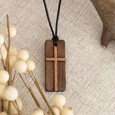 Elevate your spiritual journey with the Maggie Wooden Cross Necklace. Featuring a two-tone wooden pendant showcasing the symbol of the cross, this necklace brings meaning to your every day. Brown Cross Pendant Necklace As Gift, Brown Crucifix Cross Necklace As Gift, Brown Cross Pendant Necklace For Gift, Spiritual Brown Cross Necklace, Spiritual Brown Crucifix Necklace, Brown Spiritual Necklace With Cross Pendant, Brown Crucifix Necklace In Spiritual Style, Adjustable Brown Cross Pendant Necklace, Wooden Cross Necklace