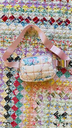 Introducing our gorgeous Quilted Floral Print Belt Bag. This adorable bag features a beautiful blue and pink floral design, complimented by a quilted pattern and gold zipper. Its adjustable strap makes it the perfect accessory for any occasion. Grab this gorgeous bag now! *All Sales Final on Accessories Quilted Crossbody Bag Pattern, Crossbody Bag Pattern, Pink Floral Design, Gift Card Exchange, Girl With Sunglasses, Quilted Pattern, Quilted Crossbody Bag, Gorgeous Bags, Purse Jewelry