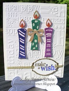 a card with two candles on it and a tag attached to the front of it