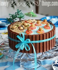 a chocolate cake decorated with cookies and palm trees