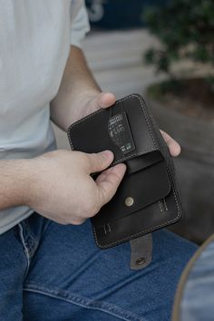 Introducing the City Wallet: A Fusion of Elegance and Utility Our City Wallet, meticulously crafted from natural leather, showcases a striking blend of black leather and light brown stitching. This wallet seamlessly embodies comfort, practicality, durability, style, and compactness. Each stitch is expertly applied by hand using waxed thread, employing the formidable saddle stitching technique. The finishing touch involves hand-sanding and polishing the edges with the Japanese Tokonole polishing Black Leather Wallet As Gift, Leather Trifold Wallet With Rfid Blocking As Gift, Gift Black Trifold Wallet With Card Slots, Handmade Rectangular Wallets For Everyday Carry, Trifold Card Holder With Coin Pocket As Gift, Trifold Card Holder With Coin Pocket For Gift, Black Trifold Wallet With Rfid Blocking As Gift, Handmade Rectangular Wallet For Everyday Carry, Handmade Rectangular Wallet For Everyday Use