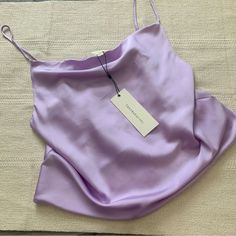 Dance And Marvel Cowl Neck Crop Satin Silk Cami. Size Medium. Color: Lavender Purple. So Cute! Flowy Top, Soft Material. Camisole With Cowl Neckline And Adjustable Straps. Fit Is Loose And Drapey. New With Tags. Never Worn. Still Has Tags. Purple Summer Party Camisole, Summer Party Purple Camisole, Spring Party Purple Camisole, Elegant Purple Camisole For Summer, Elegant Purple Summer Camisole, Chic Fitted Purple Camisole, Surprise Dance Outfits, Surprise Dance, Purple Outfit