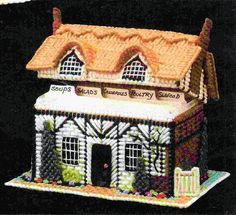 a small house made out of legos on a black background with the words soup's famous pastry shop