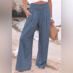 Linen Blend Pants With Pockets Color Is A Slate Blue Beach Straight Leg Bottoms Solid Color, Straight Leg Beach Bottoms In Solid Color, Straight Leg Solid Color Beach Bottoms, Baggy Blue Pants For Beach, Baggy Blue Pants For The Beach, Light Blue Wide-leg Pants, Light Blue Wide-leg Pants With Pockets, Vacation Straight Leg Bottoms In Solid Color, Chic High Waist Washed Blue Bottoms