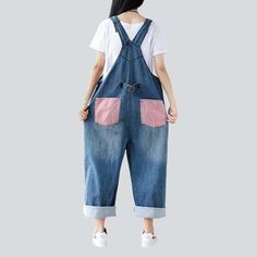 Introducing our 2023 Autumn Collection contrast color women's denim overalls ââ‚?a street style wardrobe staple that promises to make you the talk of the town!Why You'll Fall In LoveThis jumpsuit is the perfect amalgamation of modern fashion sensibilities and Y2K nostalgia. Crafted with love and care. it features a loose. baggy silhouette. intricate painted prints. and a sanded finish for a unique texture. Its vibrant color and delicate suspenders and buttons closure make for an eye-catching ens Casual Bib Front Denim Blue Jeans, Trendy Contrast Color Cotton Jeans, Trendy Cotton Bib Front Overalls, Contrast Color Cotton Jeans, Trendy Spring Jeans With Contrast Color, Spring Bib Front Denim Jumpsuit, Trendy Medium Wash Cotton Overalls, Spring Jeans With Contrast Stitching, Spring Casual Denim Bib Front Jumpsuit