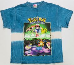 a blue shirt with an image of pokemon on it