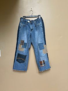 Reconstructed Baggy Patchwork Denim Capri Jeans  Stretch waist ( I added elastic inside waistband in back and sides ) I also added an extra button to adjust & personalize fit  Fits size 14 women's  13" measured across thigh 24" across back of hips  24" inseam 35" long measured from top of waist band to Raw hem Relaxed Fit Denim Blue Patchwork Bottoms, Fall Mid-rise Recycled Denim Pants, Fall Recycled Denim Blue Pants, Fall Denim Blue Patchwork Pants, Fall Patchwork Denim Blue Pants, Relaxed Fit Denim Bottoms With Patchwork, Relaxed Fit Denim Patchwork Bottoms, Relaxed Fit Denim Blue Patchwork Pants, Medium Wash Mid-rise Bottoms With Patchwork