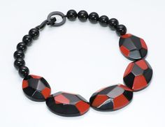 Marion Godart Bracelet & Necklace Set Limited edition Marion Godart necklace and bangle bracelet set. Red and black resin with angular corners. Beaded necklace features hook & ring clasp. Approximate Measurements: Necklace: Length 19”, Width 1.5” Bracelet: Diameter 2.3”, Width 1.5” Bracelet Size: bracelet stretches and is best suited for a small wrist Made in: France Condition: Very Good Bold Black Jewelry For Gifts, Bold Black Jewelry For Gift, Bold Black Jewelry Gift, Modern Red Bracelet Jewelry, Contemporary Red Jewelry For Gifts, Contemporary Red Jewelry For Gift, Contemporary Red Jewelry As A Gift, Bangle Bracelet Set, Genuine Love