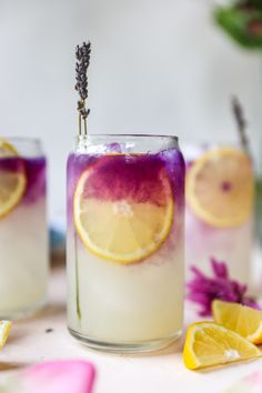 three glasses filled with lemonade and lavender