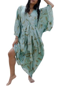 Perfect for poolside hangs or kicking it in the sand, this tie-front kaftan is the perfect accessory to add to your sun-loving wardrobe. V-neck Short sleeves 100% polyester satin Hand wash, line dry Imported Model stats: 5'10", 32" bust, 25" waist, 36" hip. Model is wearing size One Size. Bohemian V-neck Tie Waist Cover-up, V-neck Beach Dress With Tie Waist For Vacation, Bohemian Tie Waist Cover-up For Beach Season, Breezy Wrap Cover-up For Vacation, Beach Season Cover-up With Tie Waist, Summer Beach Cover-up With Tie Waist, V-neck Swimwear With Tie Waist For Summer, Flowy V-neck Kaftan For Day Out, Bohemian V-neck Swimwear For Spring