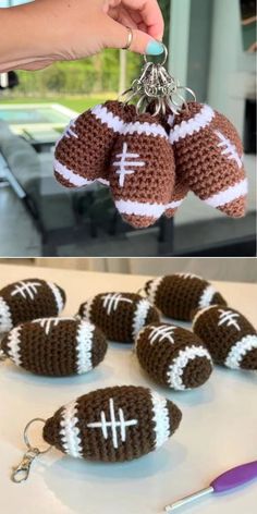 crocheted football keychains are being displayed on a table with other items