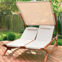 an empty chaise lounge on a wooden deck