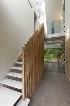 the stairs are made of wood and white