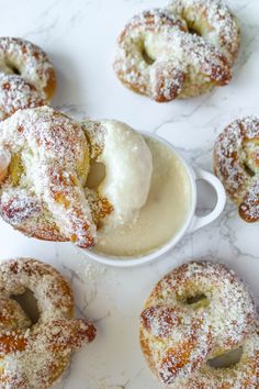 powdered doughnuts and ice cream on a marble table