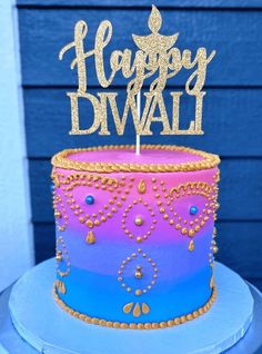 there is a cake that says happy diwal on it