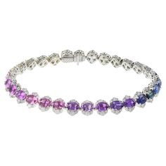 Indulge in luxury with this exquisite 18KT white gold bracelet, adorned with a stunning 16.18CT-TW of oval cut unheated natural multi color sapphires and 3.70CT-TW of F-VS round cut diamonds. Each stone is carefully selected and certified by GIC to ensure the highest quality and value. Elevate your style with this one-of-a-kind piece, featuring 16.18CT-TW of sparkling sapphires and 3.70CT-TW of dazzling diamonds. This bracelet will be a prized addition to your collection, exuding sophistication Ceylon Blue Sapphire, Ruby Bracelet, Modern Bracelets, White Gold Bracelet, Rose Gold Bracelet, Yellow Gold Bracelet, Sapphire Stone, Sapphire Diamond, Round Cut Diamond