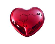 a red heart shaped object with the chemical formula on it