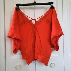 Beautiful, Brand New Boho Top In Size Large Off Shoulder Boho Look Features Batwing Sleeves, Flowers, And Ties Together In The Back. Burnt Orange Or Dark Red Beautiful Color Brand New Cute V-neck Blouse For Vacation, Red Cotton V-neck Crop Top, Red V-neck Cotton Crop Top, Cute Red V-neck Top, Cute V-neck Blouse For Beach, Cute V-neck Blouse For The Beach, Cute Red Tops For Vacation, Casual Red V-neck Peasant Top, Red Bohemian Tops For Summer