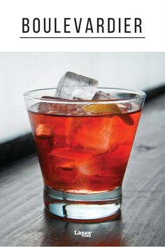 a close up of a drink in a glass on a table