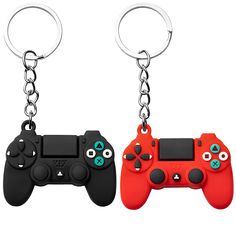 two video game controllers keychains are shown in red, black and blue colors