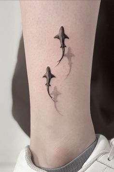 three dolphins tattoo on the ankle