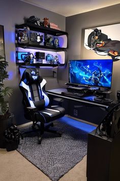 a gaming room with two computer monitors and a chair in front of the monitor screen