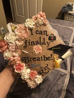 a graduation cap that says i can finally breathe