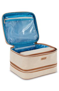 This spacious cosmetics case is designed with top and bottom storage compartments perfect for organizing essentials at home and on the go. Exterior zip closures   Top carry handles   Interior zip and wall pockets; removable zip pouch   60% recycled preconsumer polyester, 40% recycled preconsumer cotton   Wipe with damp cloth   Imported Rectangular Cosmetic And Toiletry Storage With Zipper, White Cosmetic And Toiletry Storage For Travel, White Rectangular Travel Organizers, Rectangular White Travel Organizers, Dop Kit, Organizing Essentials, Cosmetic Train Case, Stephanie Johnson, Lotion Candles