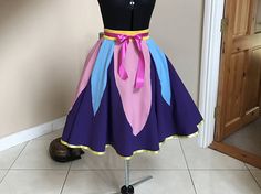 Tea length, full circle skirt giving it plenty of room for a tutu underneath for added fullness but it looks great without the petticoat(see last picture) Inspired by Mrs. Potts head piece and collar .Belle and Chip / Mrs Potts inspired set AVAILABLE here :  https://www.etsy.com/ie/listing/535261712/inspired-by-mrs-potts-head-piece-and?ref=shop_home_active_1  High waisted cirkle skirt made of medium weight bi-stretch .This fabric is medium weight and 10... Costume Full Gathered Skirt, Costume Full Skirt With Gathered Details, Fitted Full Skirt For Costume, Fitted Skirt For Cosplay Events, Fitted Gathered Skirt For Costume Party, Fitted Purple Skirt For Cosplay, Fitted Purple Skirt For Costume, Fitted Flared Skirt For Costume Party, Purple Fitted Skirt For Cosplay