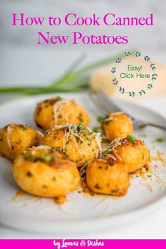 how to cook canned new potatoes on a white plate with a fork and spoon in the background