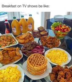 a table topped with lots of different types of breakfast foods and drinks on top of plates