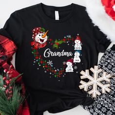 Snowman Heart Christmas Grandma And Kids CTH01 T-ShirtGreat as Birthday gifts or Holiday presents. This adorable item can be designed upon anyone's wish with any title.Please enter:1. Nickname. ie. Grandma, Nana, Mimi, ...etc.2. Kids' Names wanted on the shirt (Names separated by commas)All items are made to order.* Please be aware that the physical product's colors may differ slightly from the mockup. Brand: Gildan Classic unisex cut makes this easy to fit the body. Material: Heavyweight fabric T Shirts For Couples, Shirt Names, Customized Shirts, Heart Christmas, Holiday Presents, Custom Tee Shirts, T Shirt Company, Sublime Shirt, Kids Names