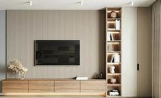 a living room with an entertainment center and bookshelves on the wall, in front of a flat screen tv