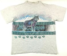 Vintage 90's Wolf Paw Prints T-Shirt 2-Sided All Over Wolves Aztec Pattern Midwestern Cowboy Mountain Range Logo Tee Size L Has a few pinholes on back as shown. BUY IT NOW! Please feel free to ask any questions you have about this item, I am here to make sure you are happy with your purchase. #BY107 Vintage Animal Shirt, Vintage National Park Shirt, Animal Shirt Design, Wolf Tshirt, Goodwill Hunting, Horse Shirts, Geeky Clothes, Wolf Paw, National Park Shirt