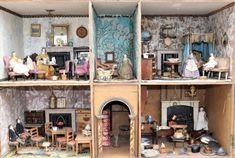 a doll house with furniture and dolls in it