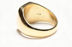 Tiffany & Co. Gold Men's Ring.Upgrade your style with this vintage Tiffany & Co. gold signet men's ring. Make a statement and exude confidence with this classic piece of jewelry. This is a men's signet ring made by Tiffany & Co. It is made of 14k yellow gold and has a wide band. The ring does not feature a main stone and is suitable for everyday wear. Ring is currently size 12.5. It can be resized upon request. Classic Hallmarked Signet Ring For Collectors, Classic Hallmarked Signet Ring Collectible, Timeless Gold Signet Ring, Timeless Hallmarked Signet Ring For Collectors, Timeless Hallmarked Signet Ring Collectible, Timeless Hallmarked Collectible Signet Ring, Classic Gold Dome Ring Collectible, Timeless Gold Signet Ring With Hallmarks, Classic Signet Ring For Anniversary With Polished Edges