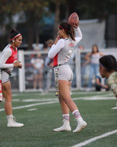 the girls are playing football on the field